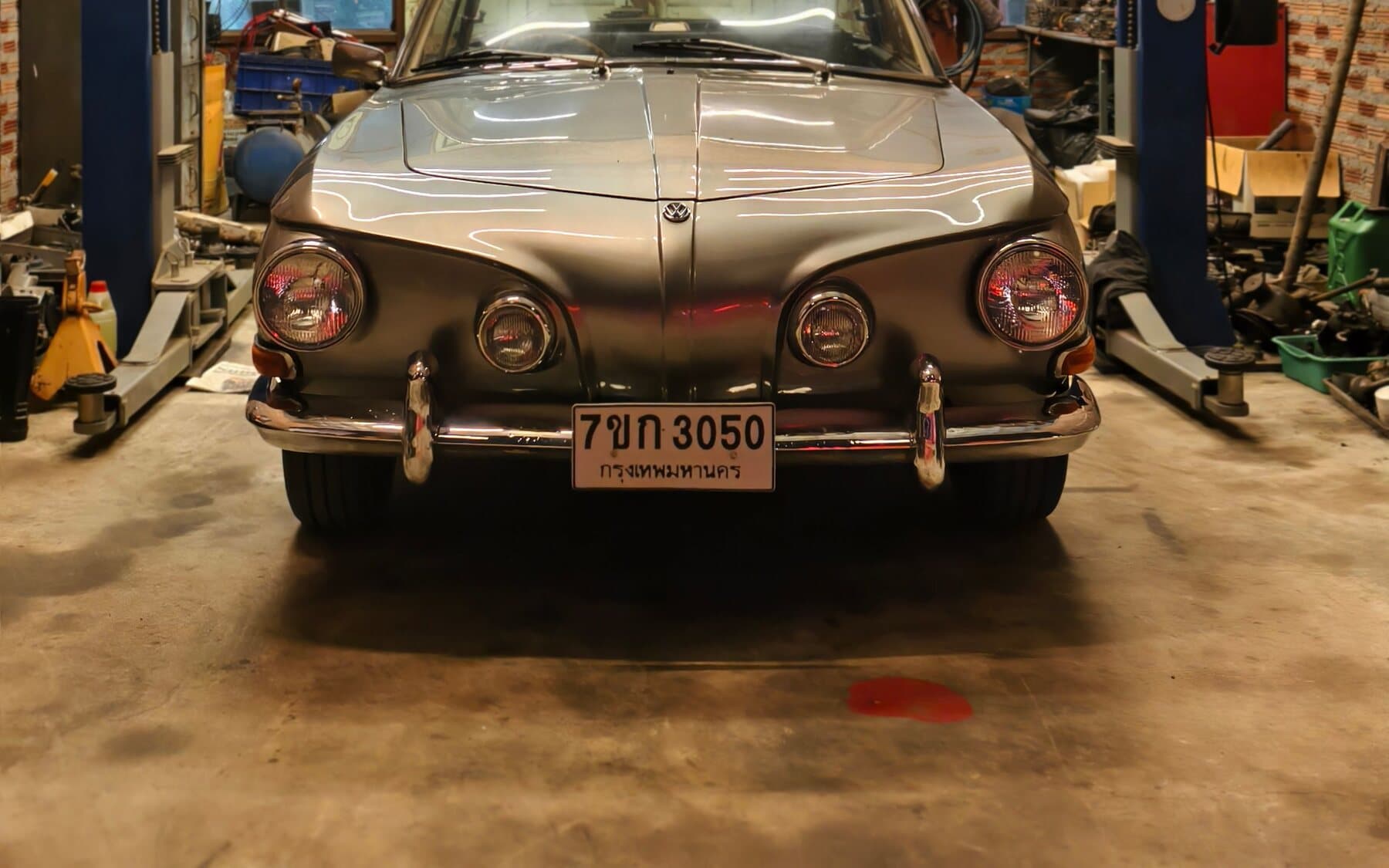 A classic car in a restoration garage, a collector vehicle insured for its agreed value
