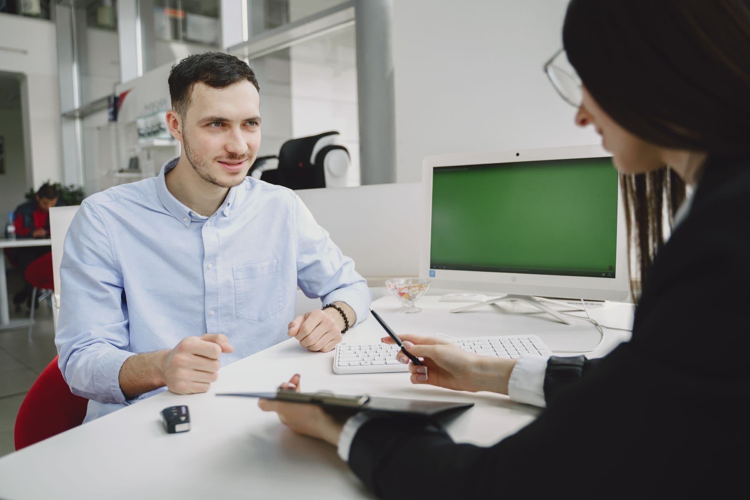 A manager interviewing an employee across a desk, the hiring and workplace decisions employment practices liability covers