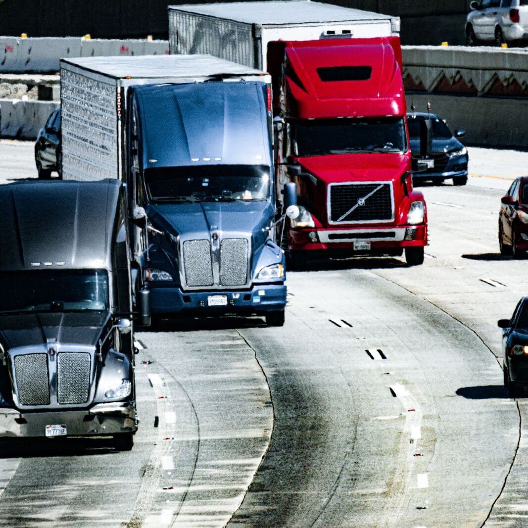 Trucks and cars on a busy highway