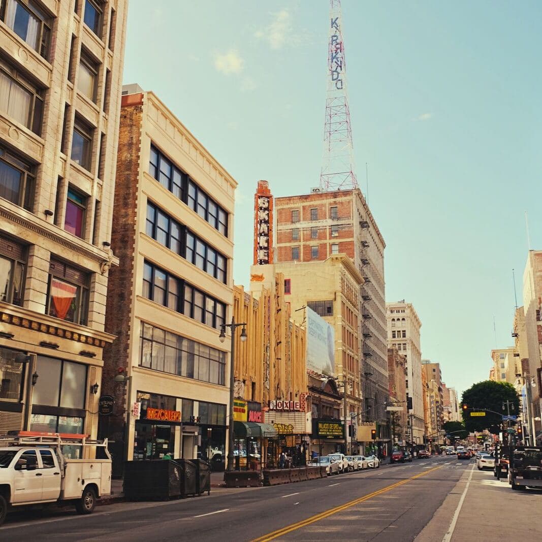 A busy downtown street lined with shops and offices