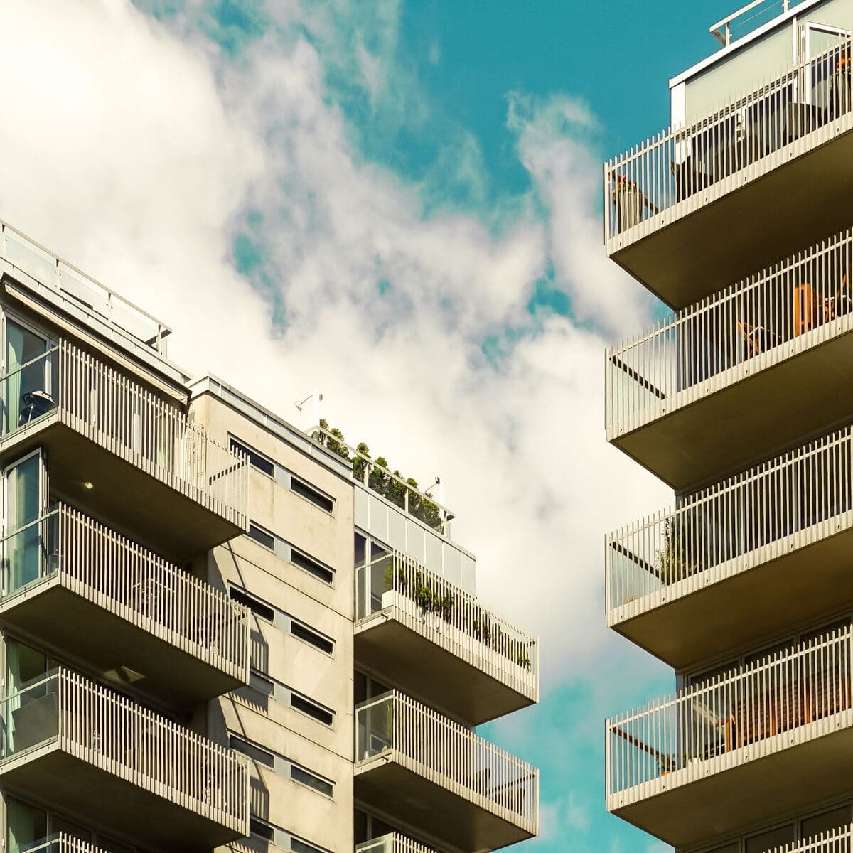 A condominium building with stacked balconies
