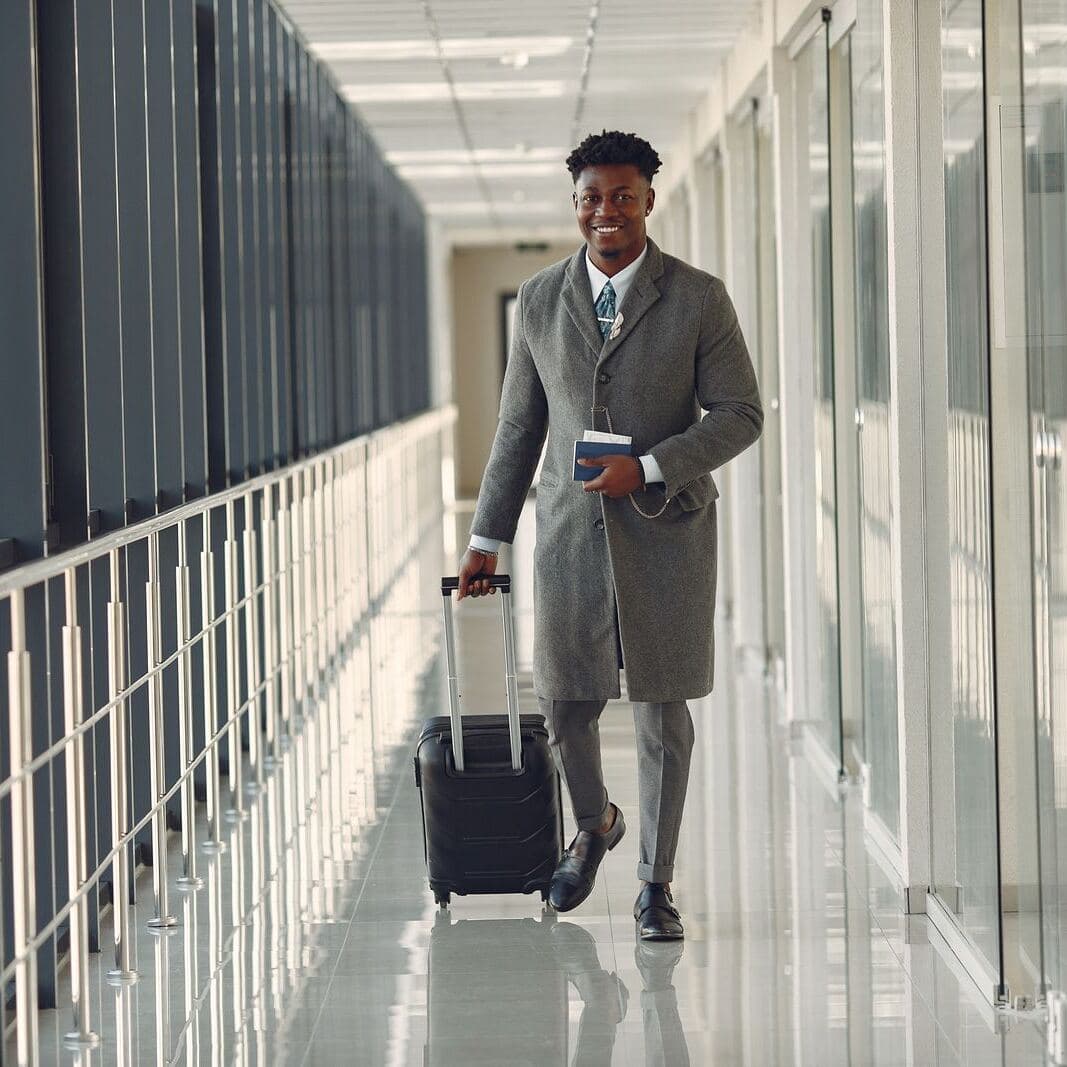 A business traveler walking through an airport
