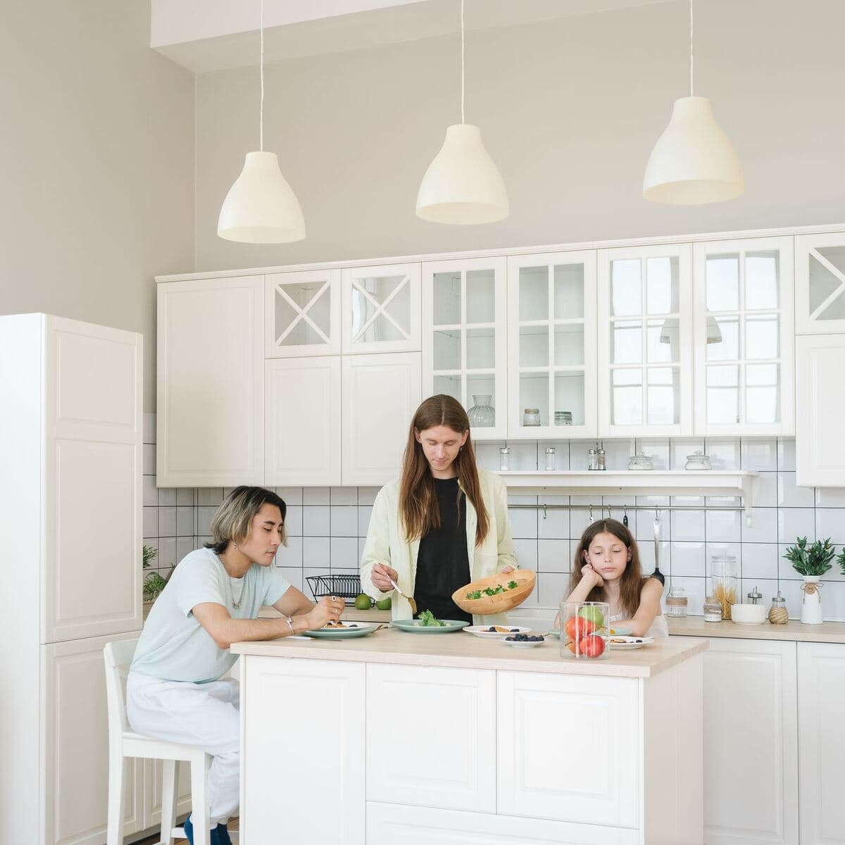 A family cooking together in the kitchen