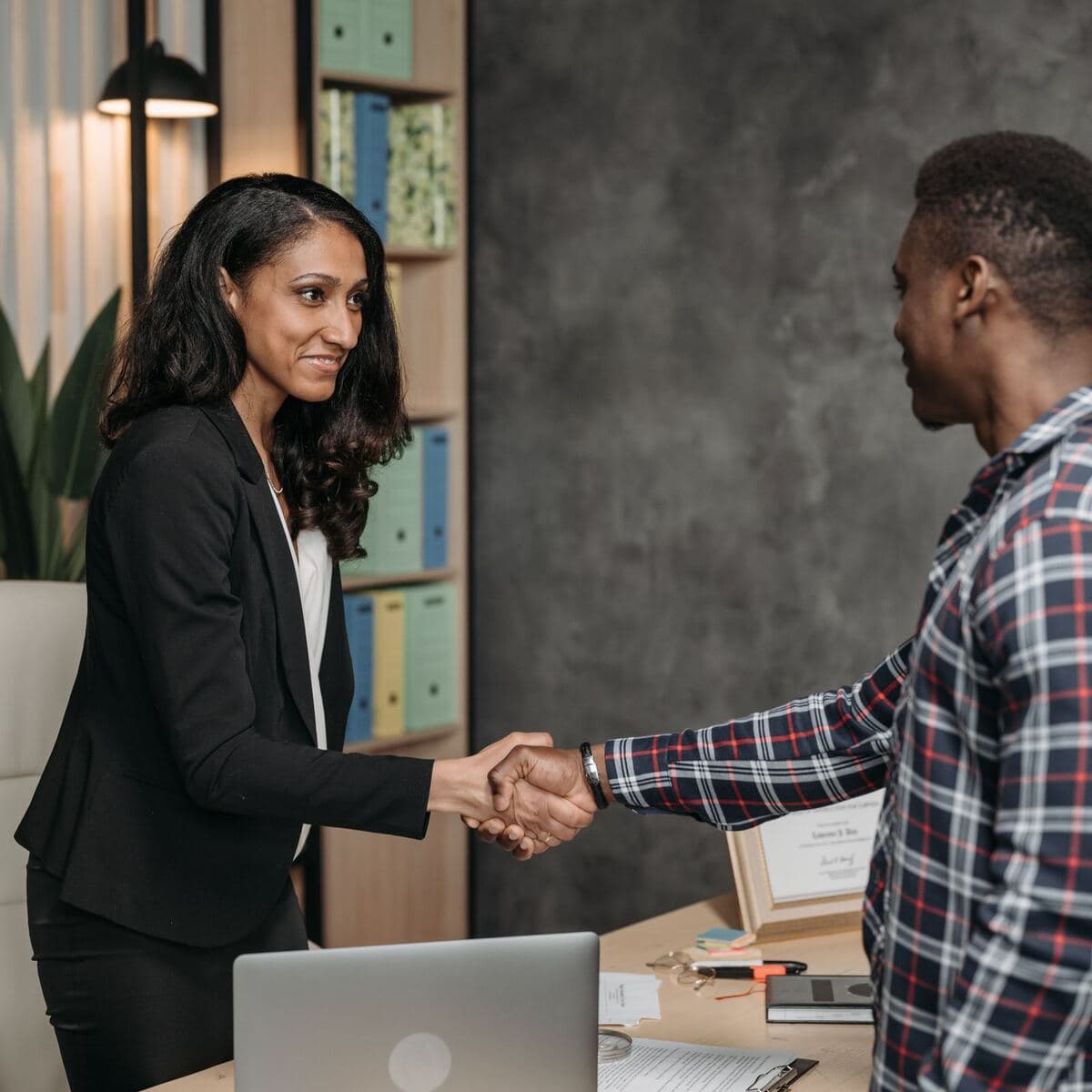 A consultant shaking hands with a client