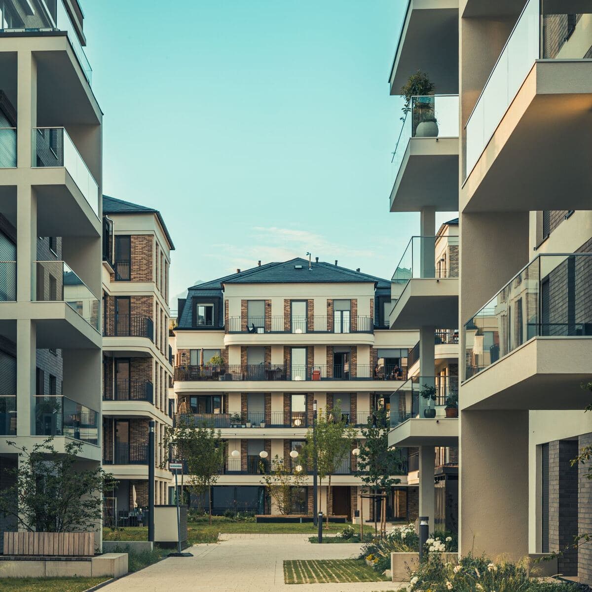 A walkway between two apartment buildings