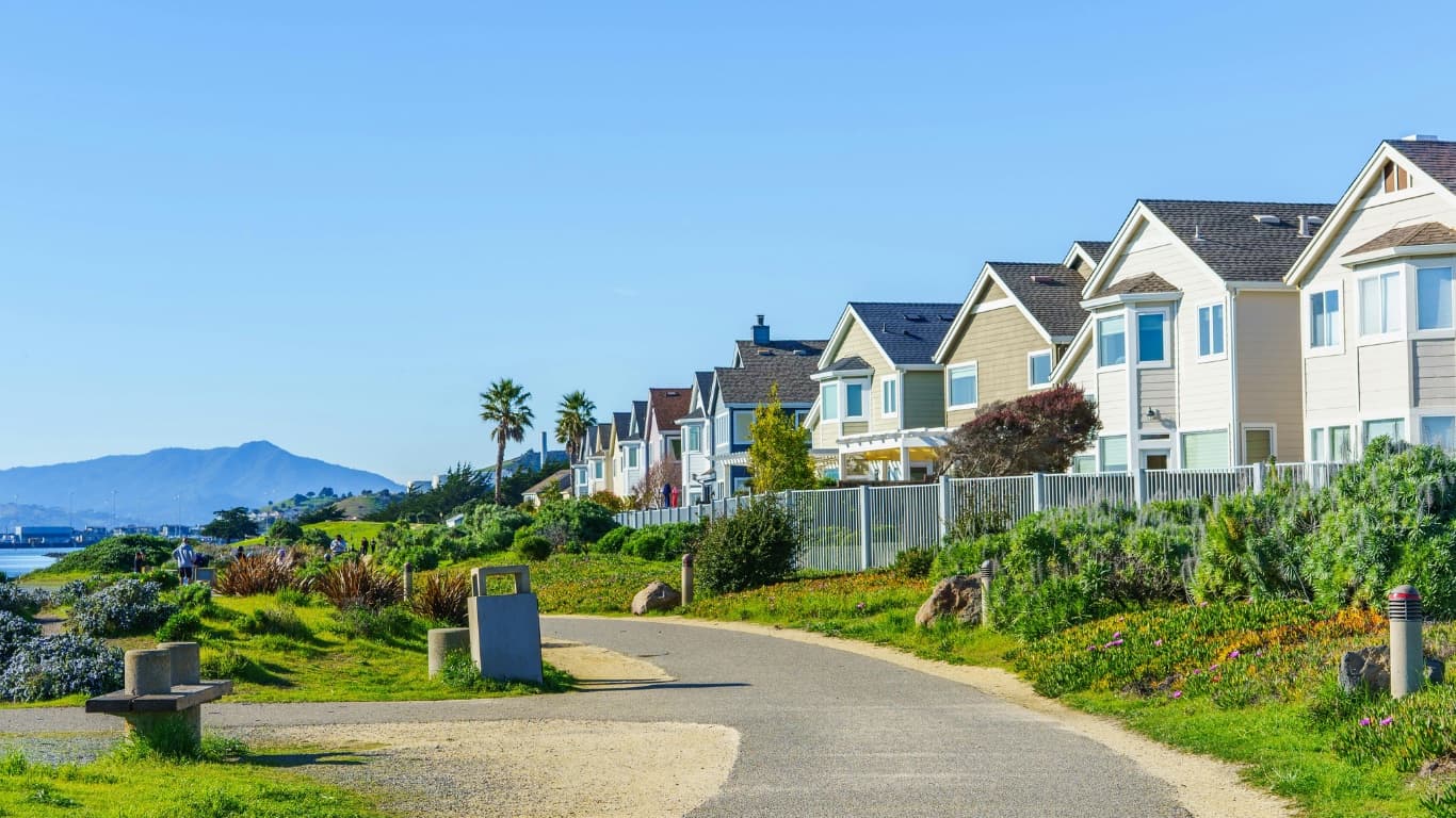 Bay Area homes along a waterfront trail with Mount Tamalpais behind, the kind of California home the FAIR Plan insures when standard insurers decline